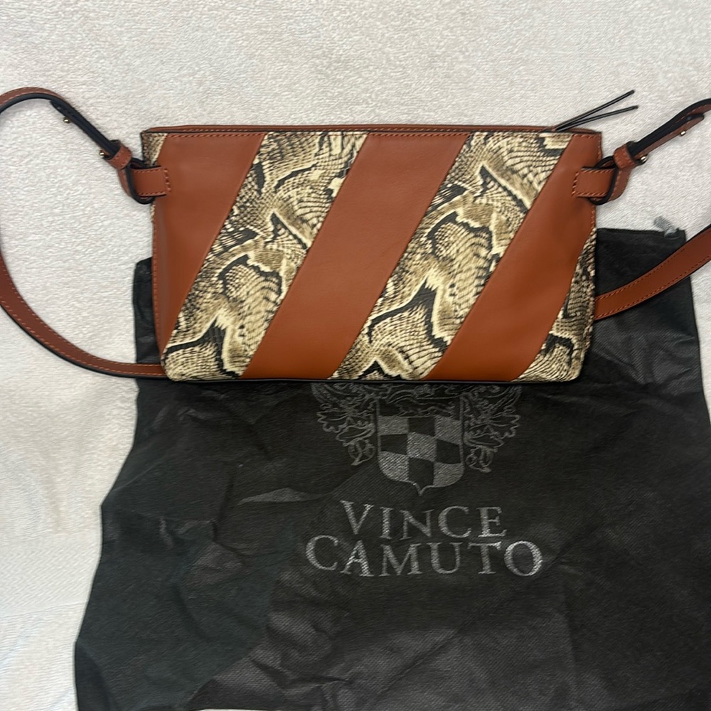 Vince Camuto Bag combines sophisticated brown leather with trendy snake-print.
